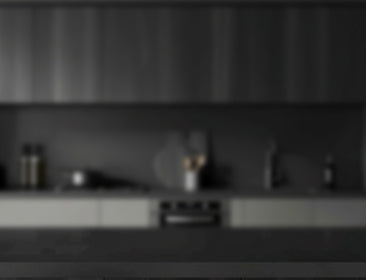 Blurred kitchen counter with appliances and items