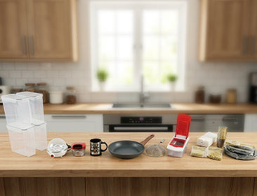Kitchen counter with various items including a measuring cup, coffee mug, and kitchen tools.